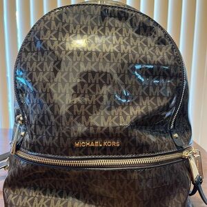 Michael Kors Brown Monogram Backpack
 12 1/12x8 1/2”